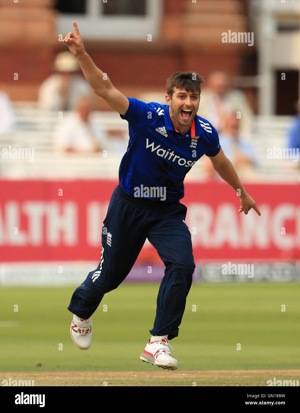 England's Mark Wood celebrates taking the wicket of Pakistan's Sharjeel Khan during the Royal London One Day International Series match at Lord's, London. Stock Photo