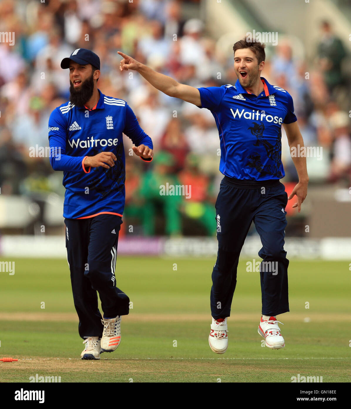 England's Mark Wood celebrates taking the wicket of Pakistan's Sharjeel Khan during the Royal London One Day International Series match at Lord's, London. Stock Photo