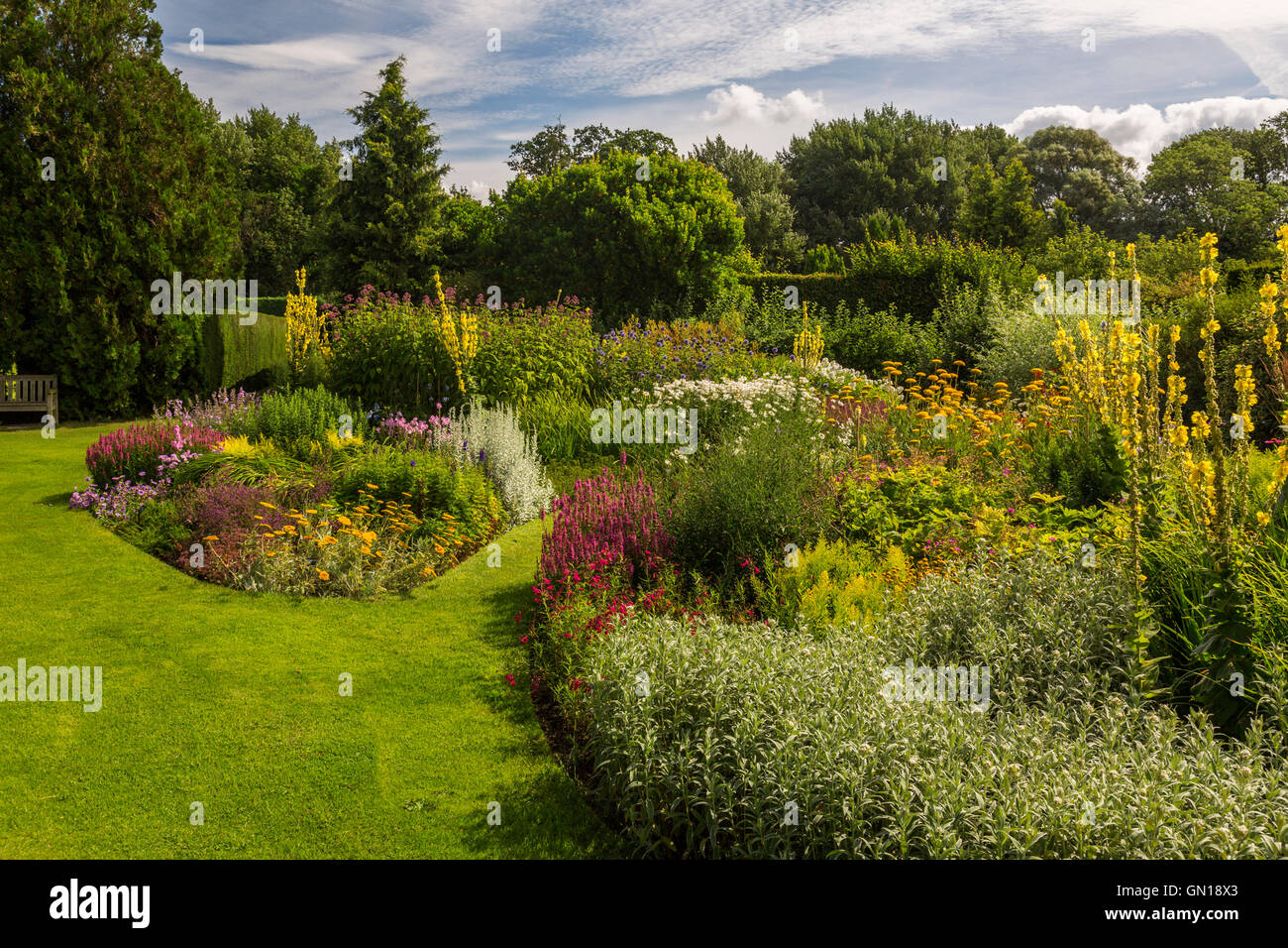 One of the well-stocked and colourful herbaceous borders at Waterperry Gardens, Oxfordshire, England, UK Stock Photo