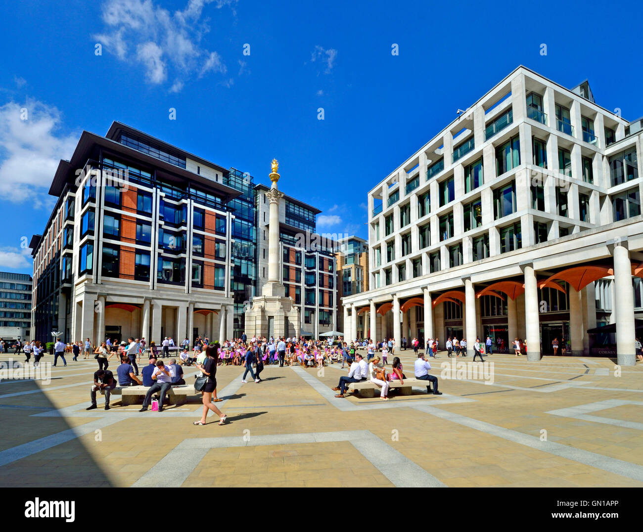 London England, UK. Paternoster Square, behind St Paul's Cathedral. Office workers having lunch outside Stock Photo
