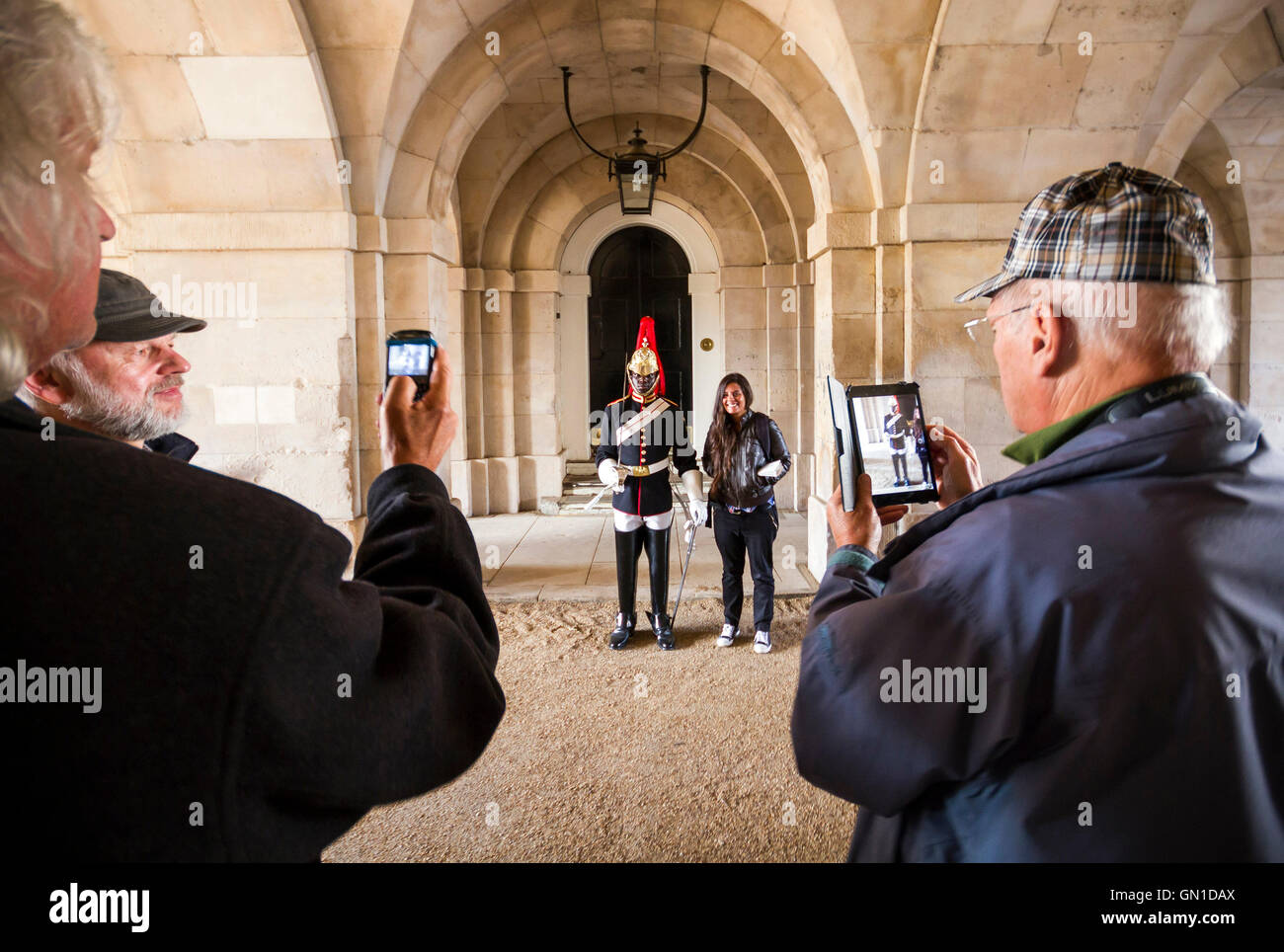 Tourists taking photos of Household Calvary at Horse Guards Parade in Westminster, London, UK. Stock Photo