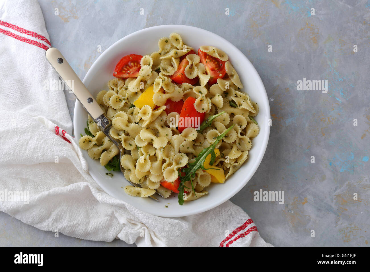 Italian Pasta with cherry tomatoes in bowl, food above Stock Photo