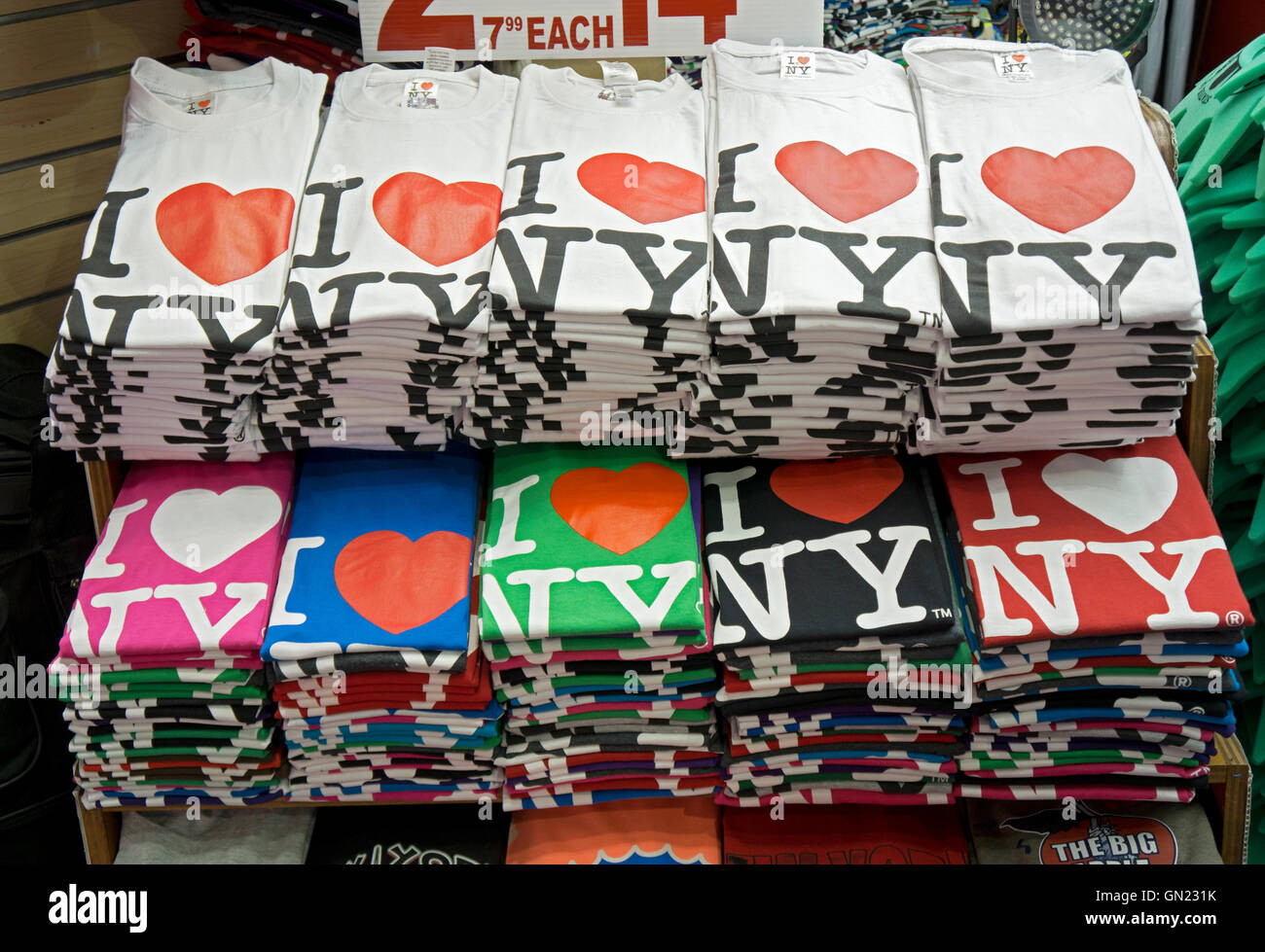 A tourist gift shop in the Times Square section of Midtown Manhattan, New York City selling inexpensive t-shirts to visitors. Stock Photo