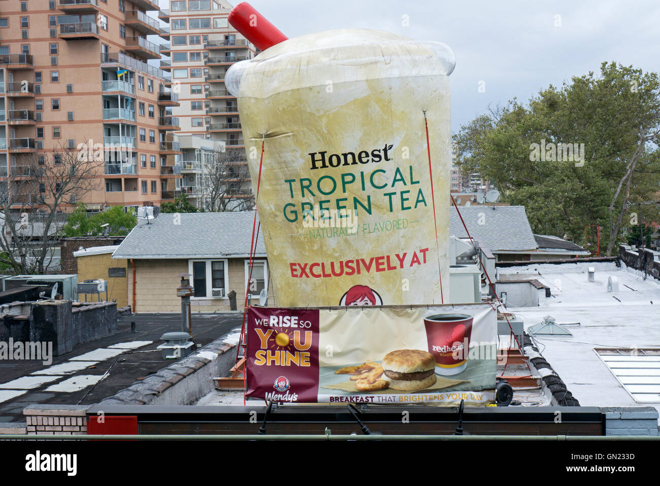 A huge inflatable cup of tea fastened to the roof of a Wendy's in Brighton Beach Brooklyn, New York. Stock Photo