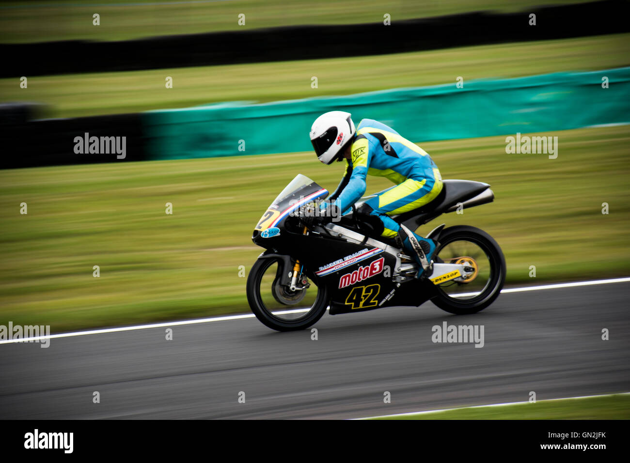 Motorcycle speeds in to the goose neck at Cadwell park , Lincolnshire, UK Stock Photo