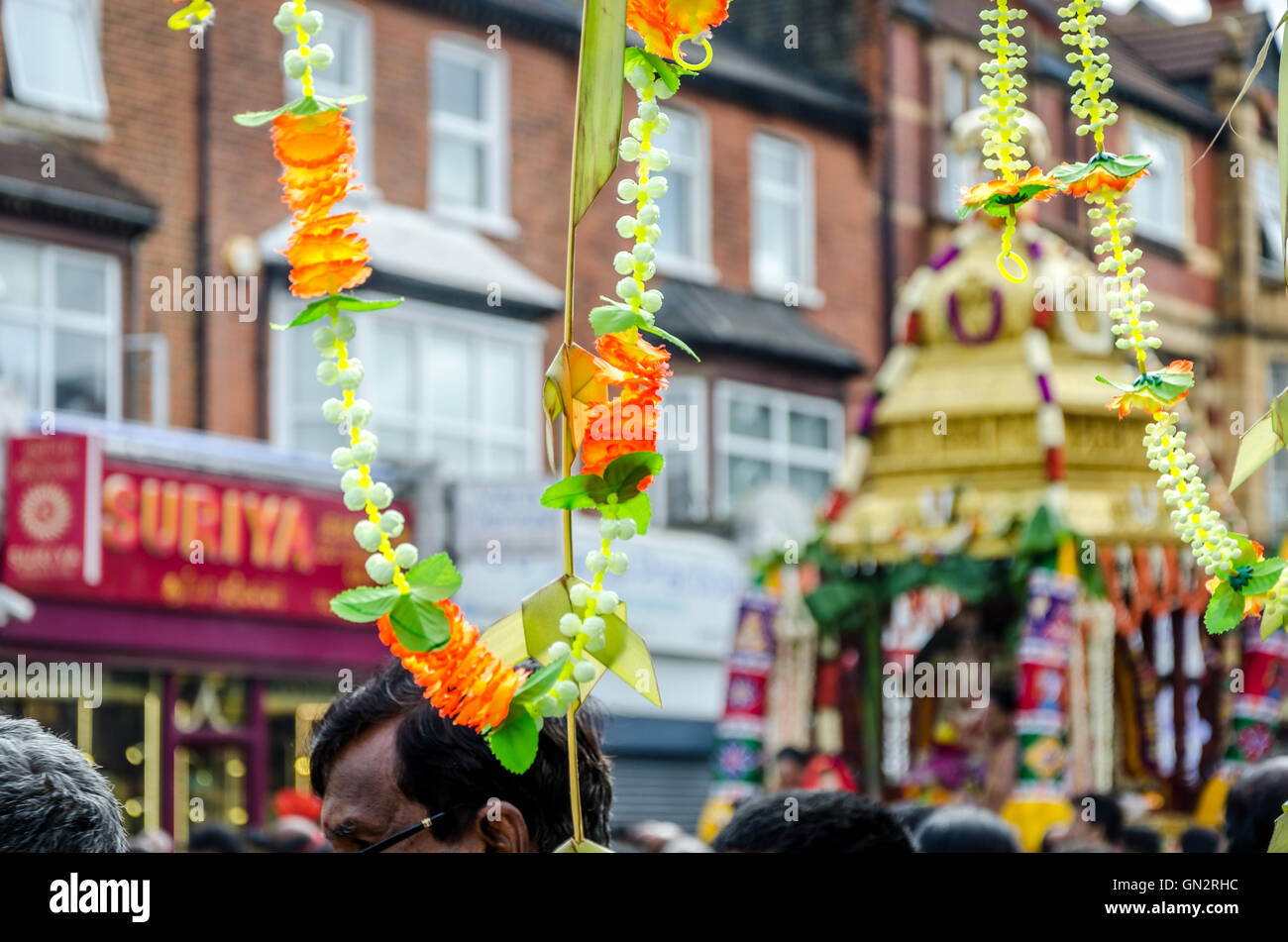 London, UK. 28 August 2016 The annual chariot festival organised by the London Sri Mahalakshmi Temple Brahmothsavam took place in east London. The chariot is pulled through the streets of east London in a pre-arranged route. Along the route blessings are given, coconuts are split and trumpets/drums are blown/drummed.  Credit:  Ilyas Ayub/ Alamy Live News Stock Photo