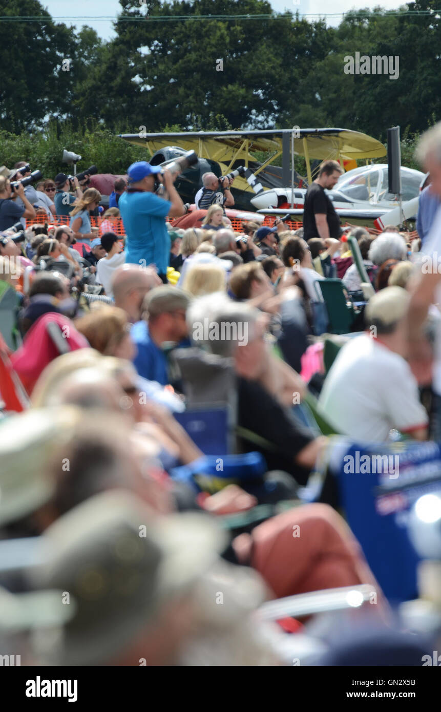 Held at a small airfield south of Cambridge, the Little Gransden Air and Vintage Vehicle Show raises funds for the BBC's Children in Need charity. Crowd Stock Photo