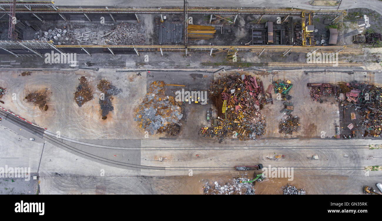 Iron raw materials recycling pile, work machines. Metal waste junkyard