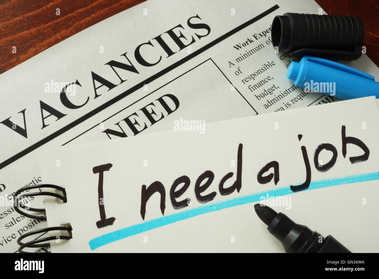 Sign I need a job in a notebook. Hiring  concept. Stock Photo