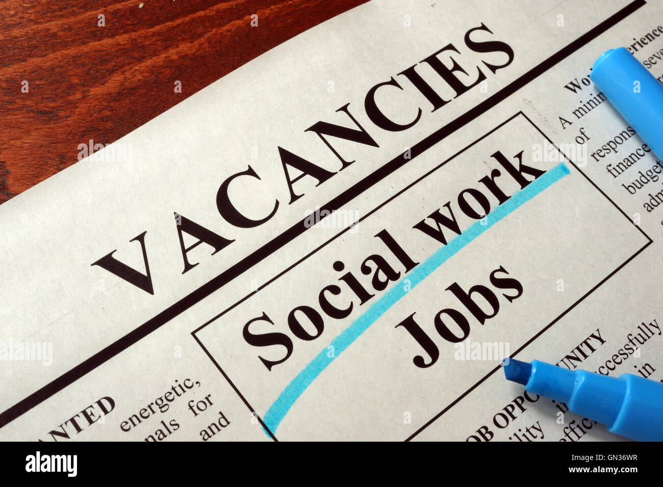 Newspaper with ads social work jobs vacancy. Occupation concept. Stock Photo