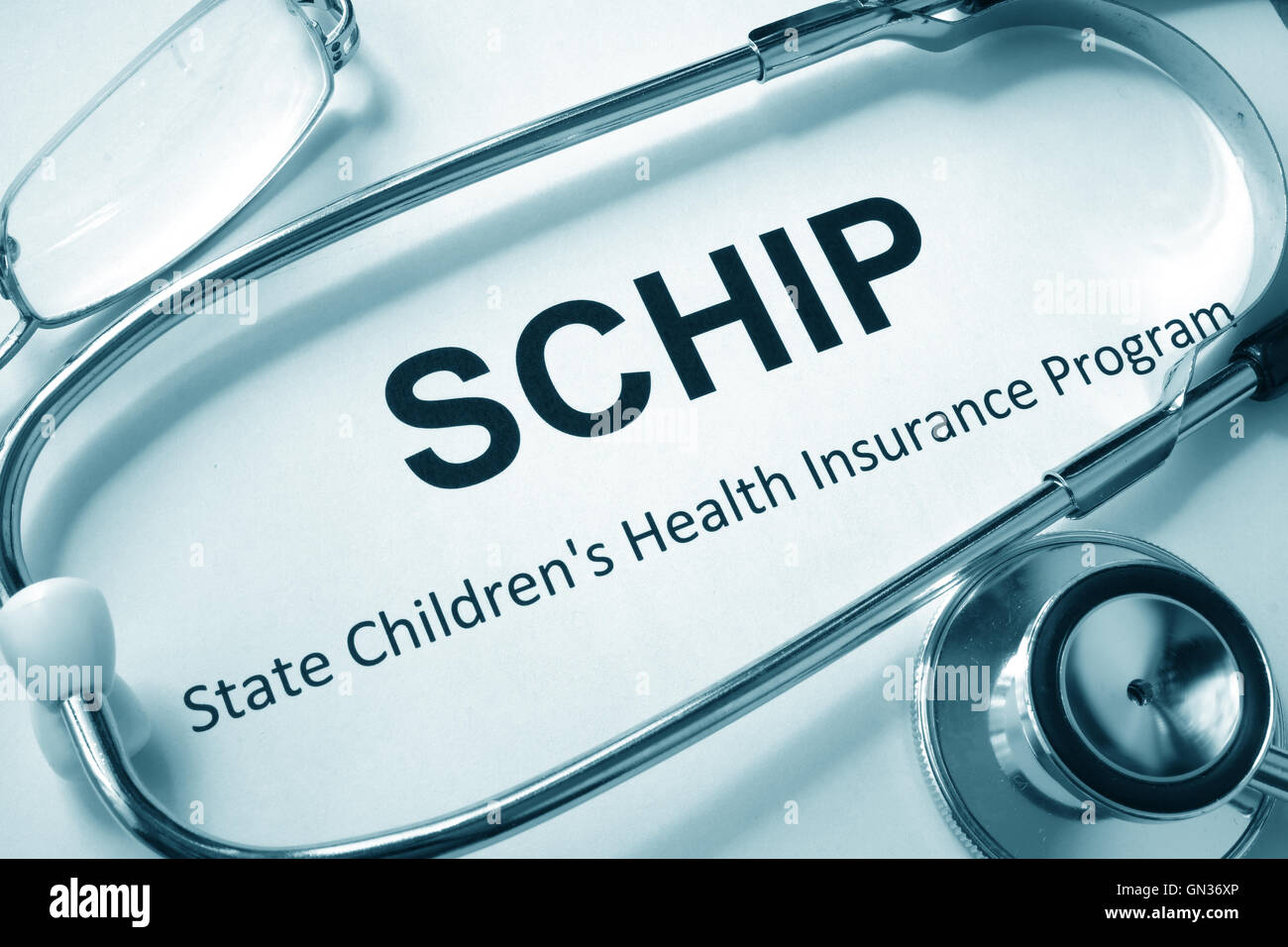 Paper with words SCHIP State Children's Health Insurance Program. Stock Photo