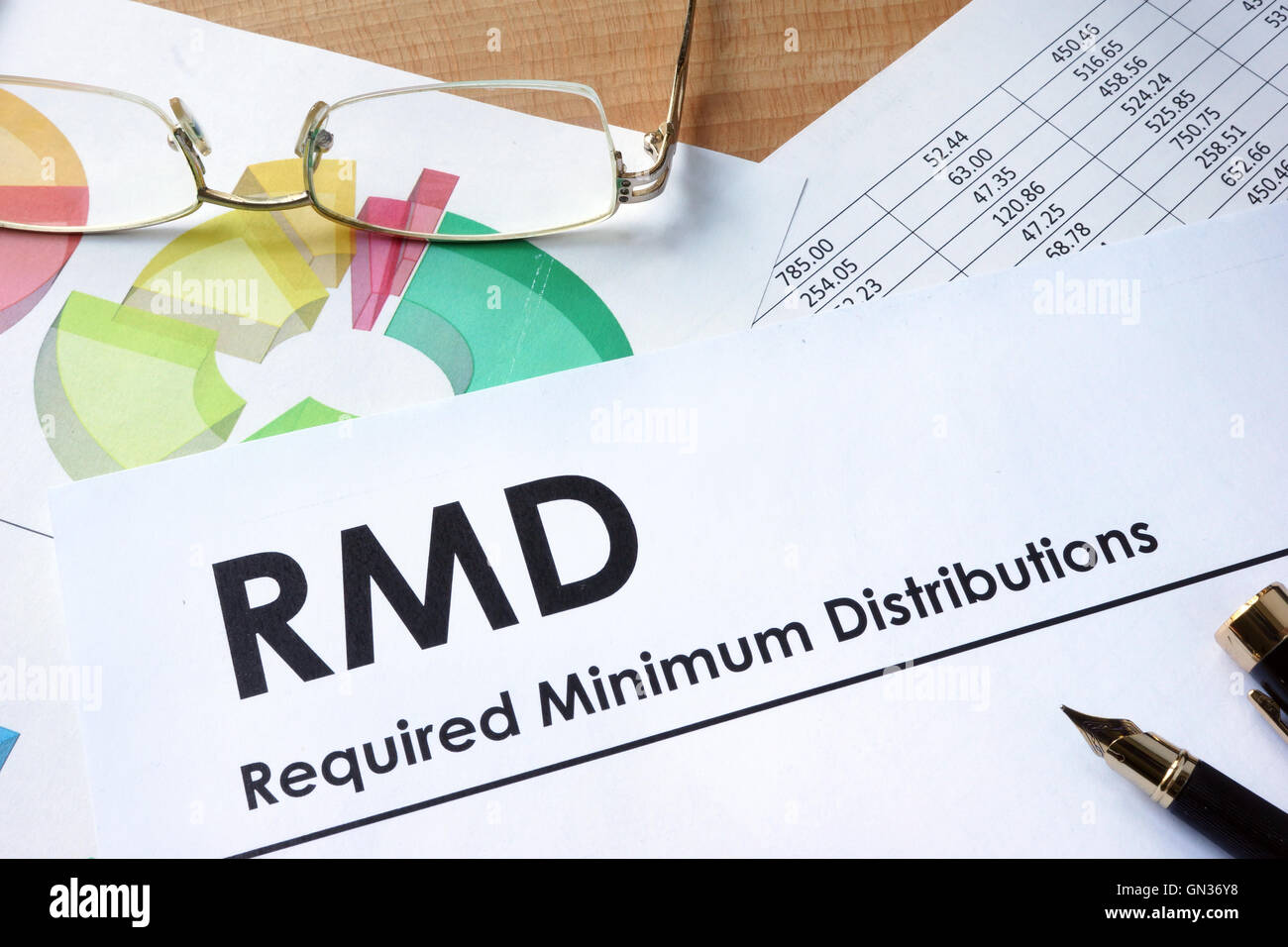 Paper with words RMD required minimum distributions Stock Photo