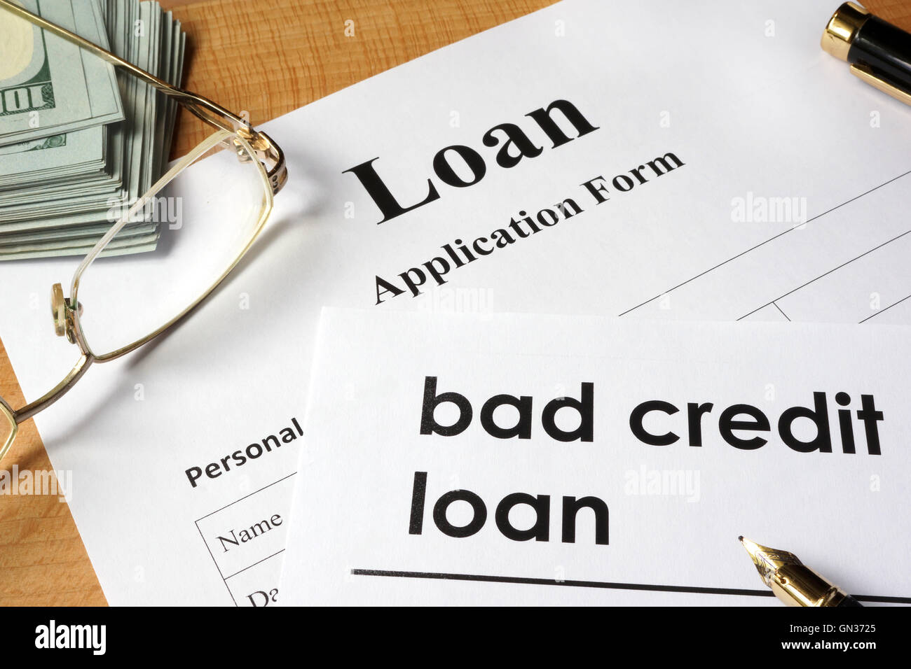 Page of Bad credit loan and application form on a table. Stock Photo