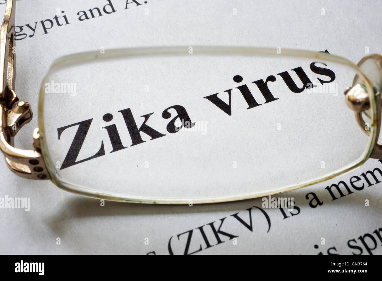 Paper with words zika virus and glasses. Medical concept. Stock Photo