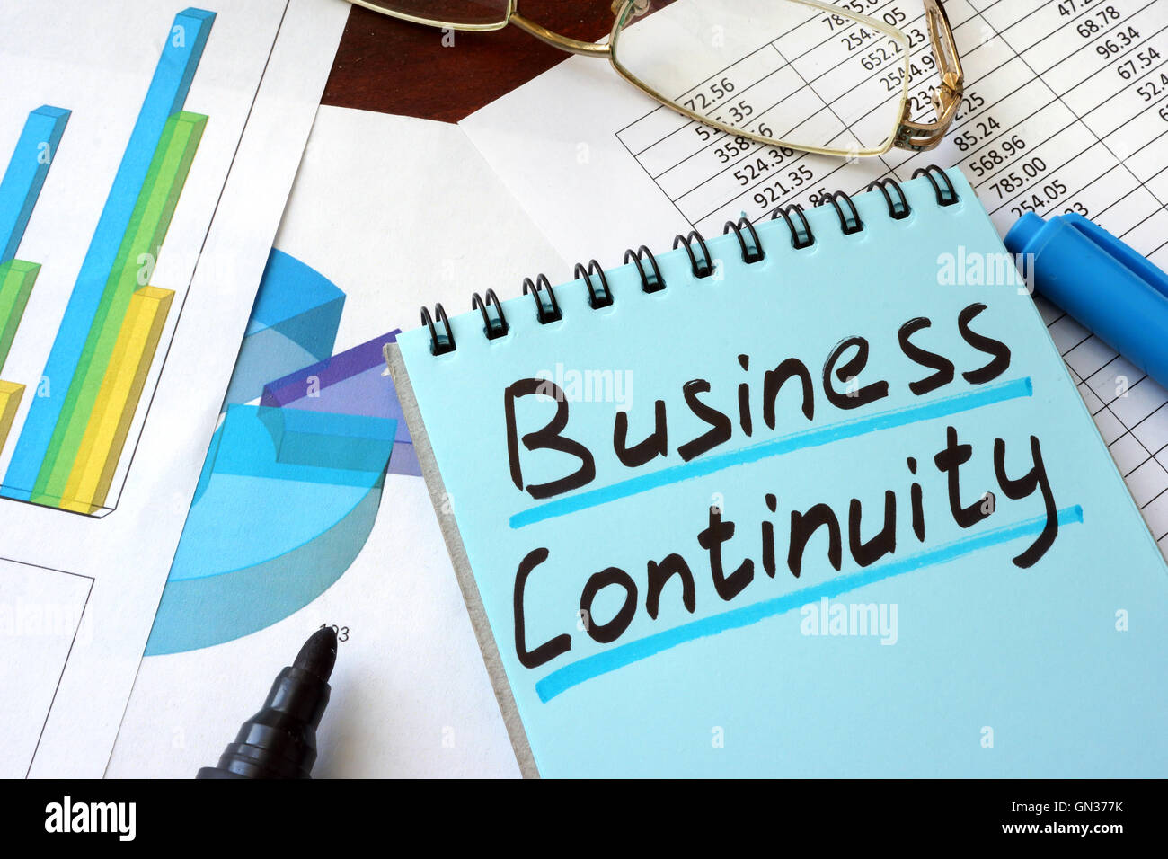 Business Continuity written on a notepad with marker. Stock Photo