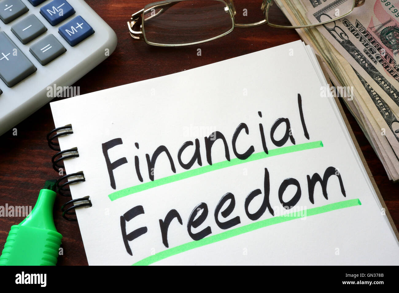 Financial Freedom written on a notepad with marker Stock Photo - Alamy