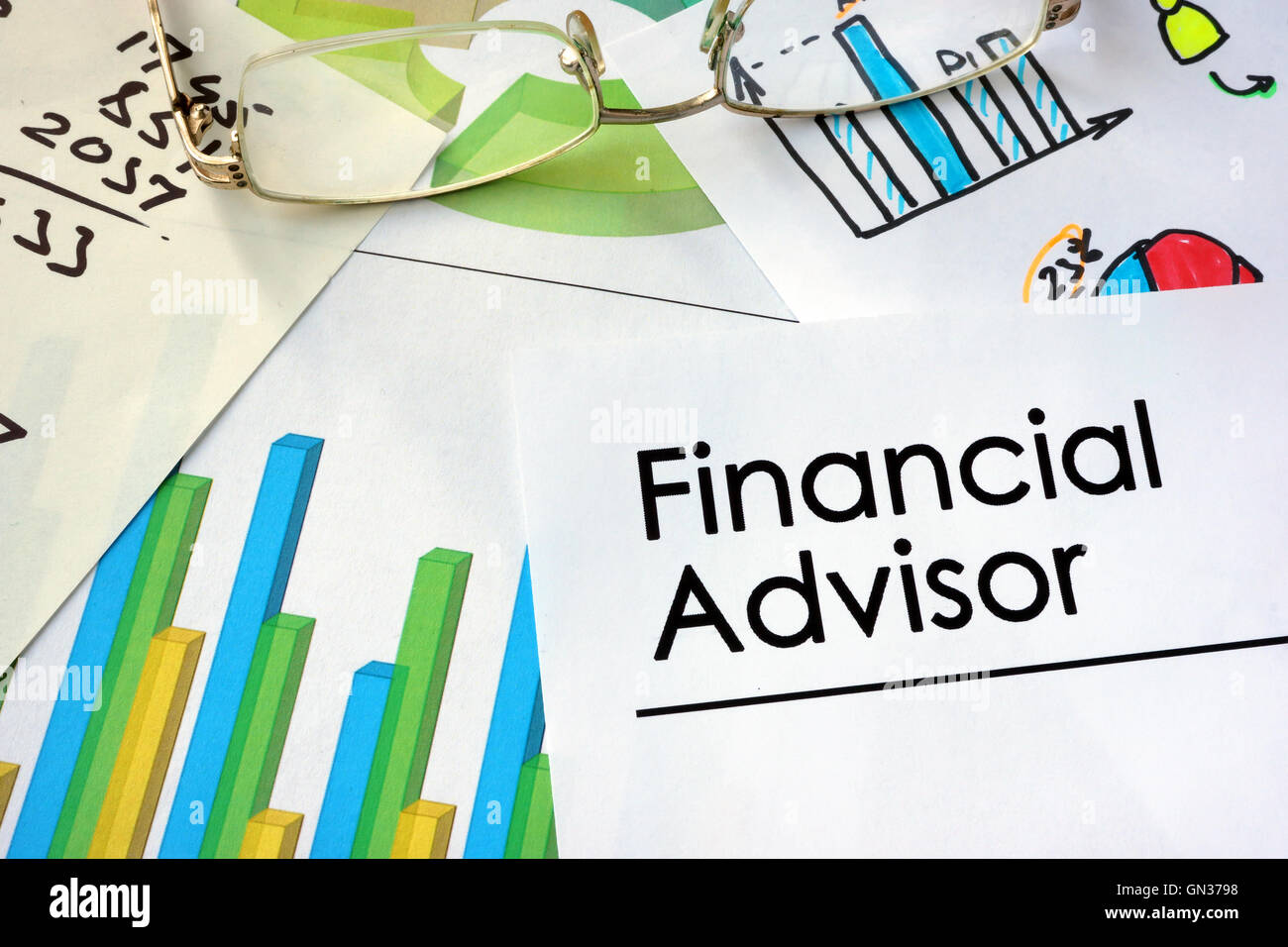 Paper with words Financial Advisor and charts. Stock Photo