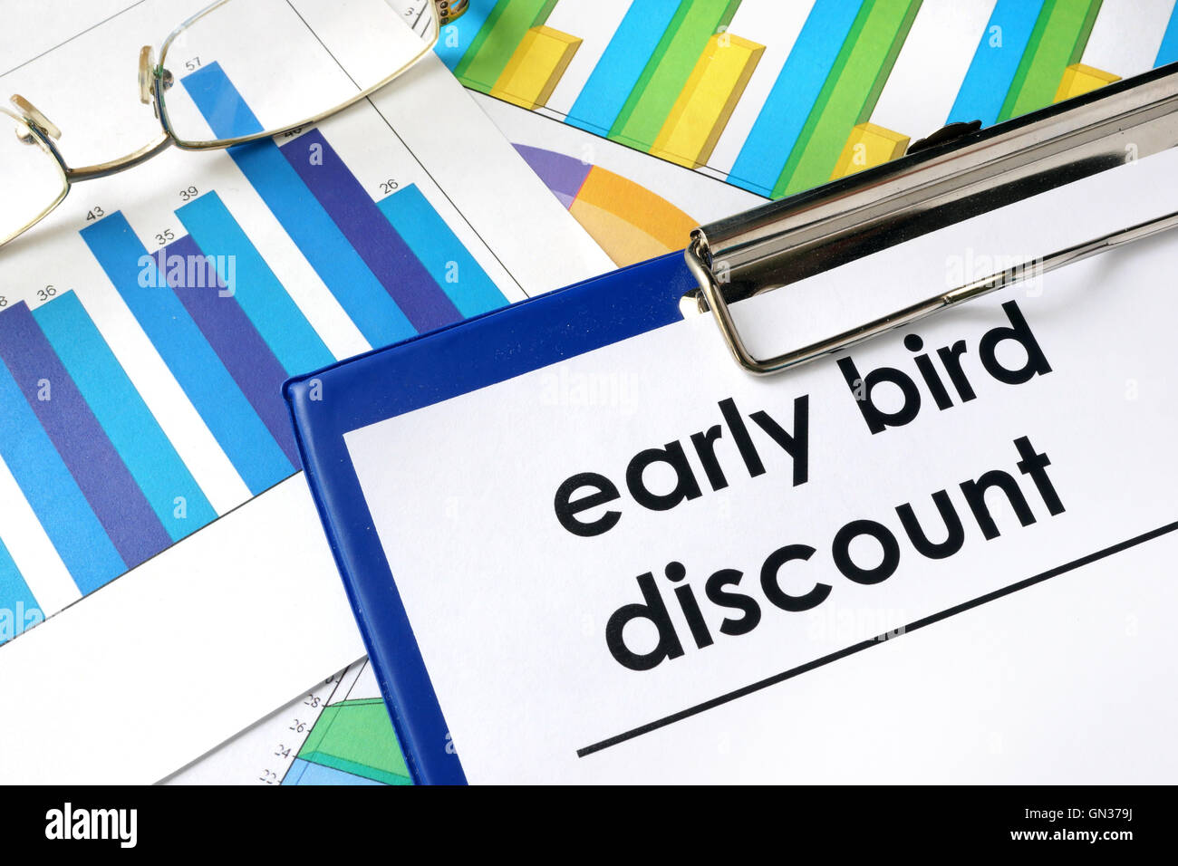 Paper with words Early bird discount and charts. Stock Photo