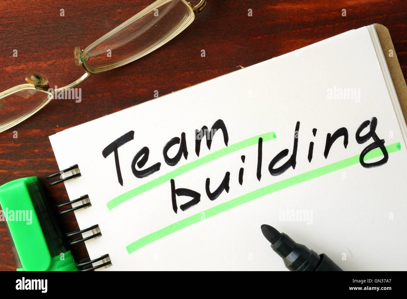 Team building sign written in a notepad. Stock Photo