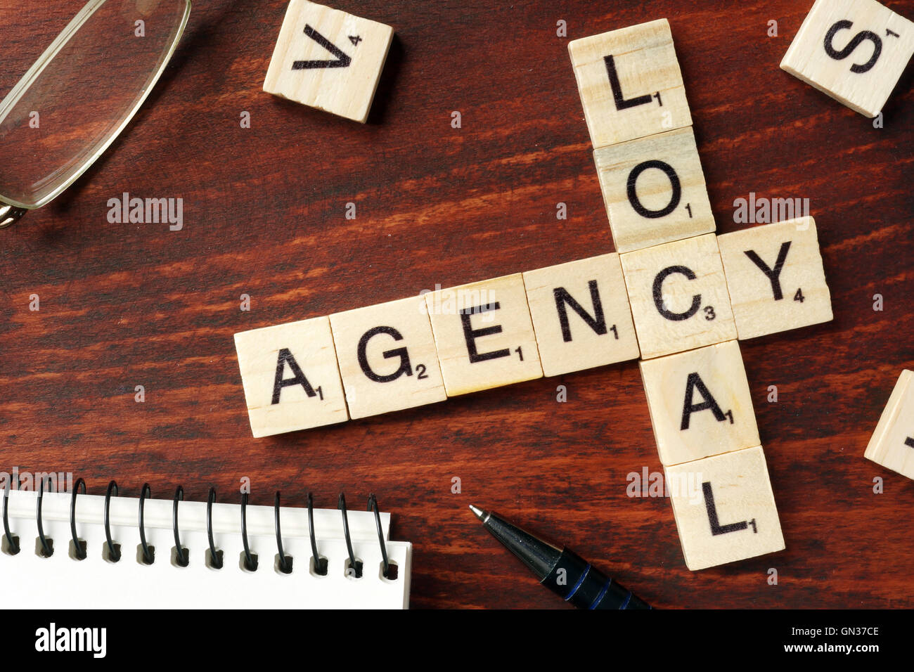 Words Local Agency from wooden blocks with letters. Stock Photo