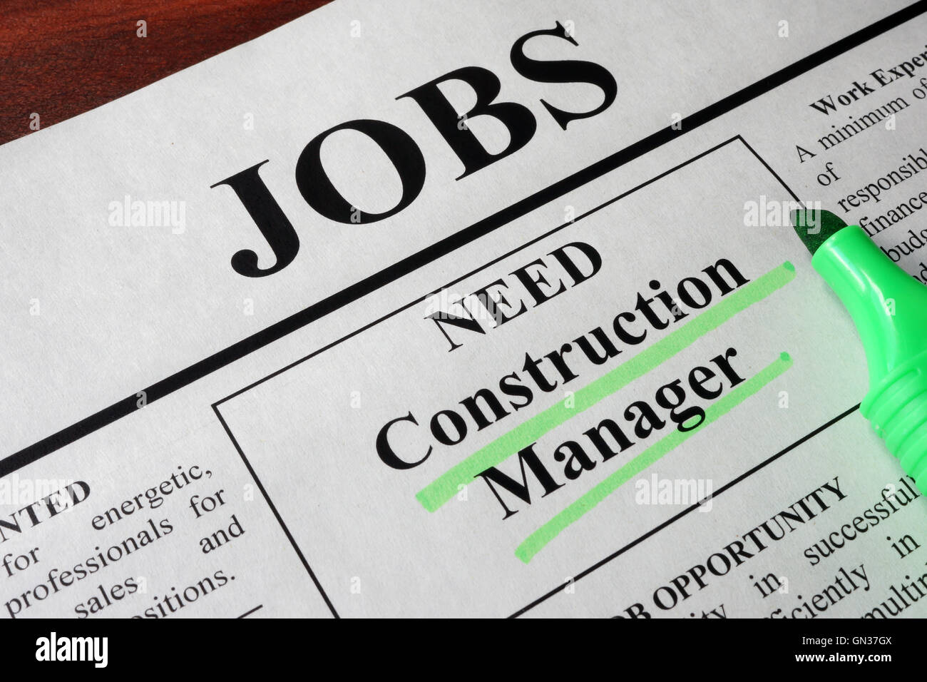 Newspaper with ads for vacancy Construction Manager. Employment concept. Stock Photo