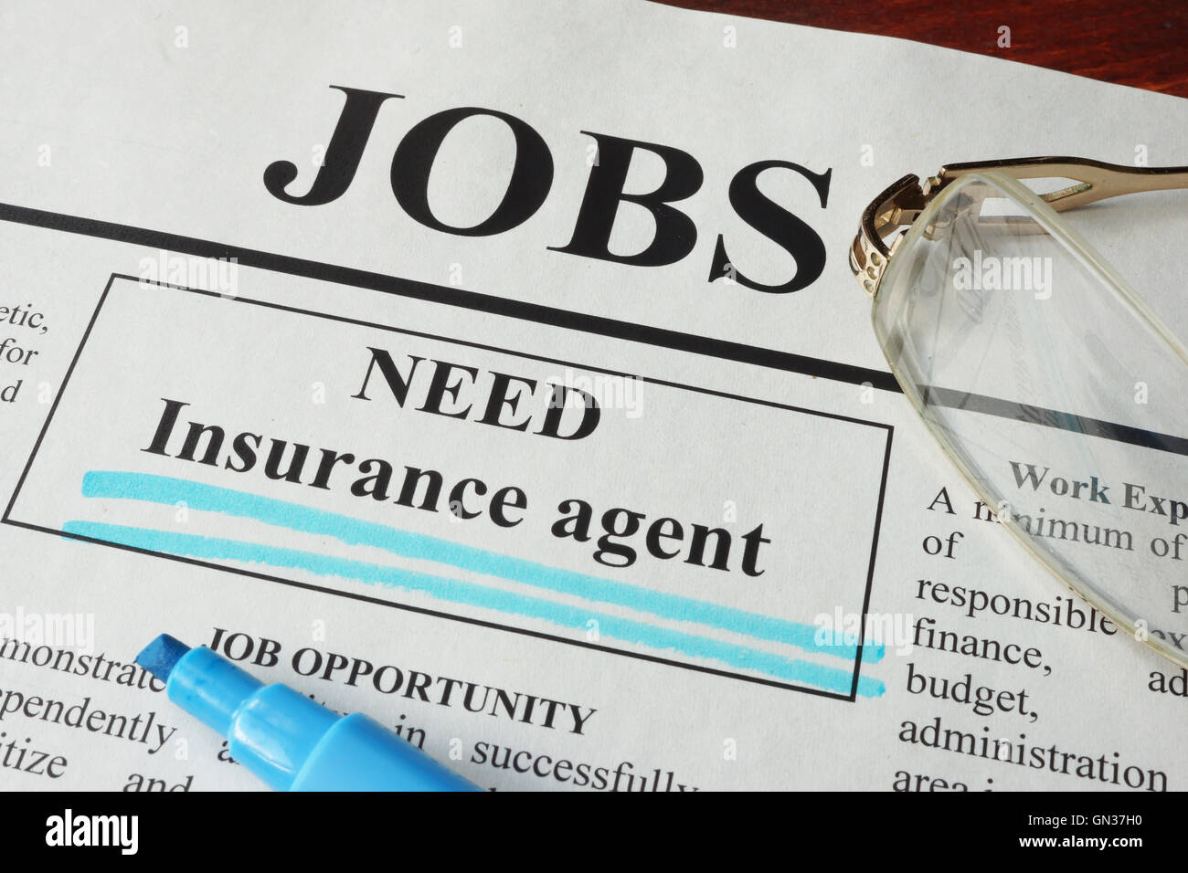 Newspaper with ads for vacancy Insurance agent. Employment concept. Stock Photo