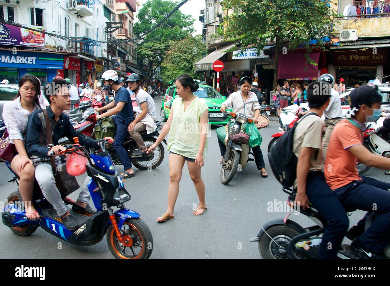 Crossing the road in Hanoi's old quarter, Hanoi, Vietnam Stock