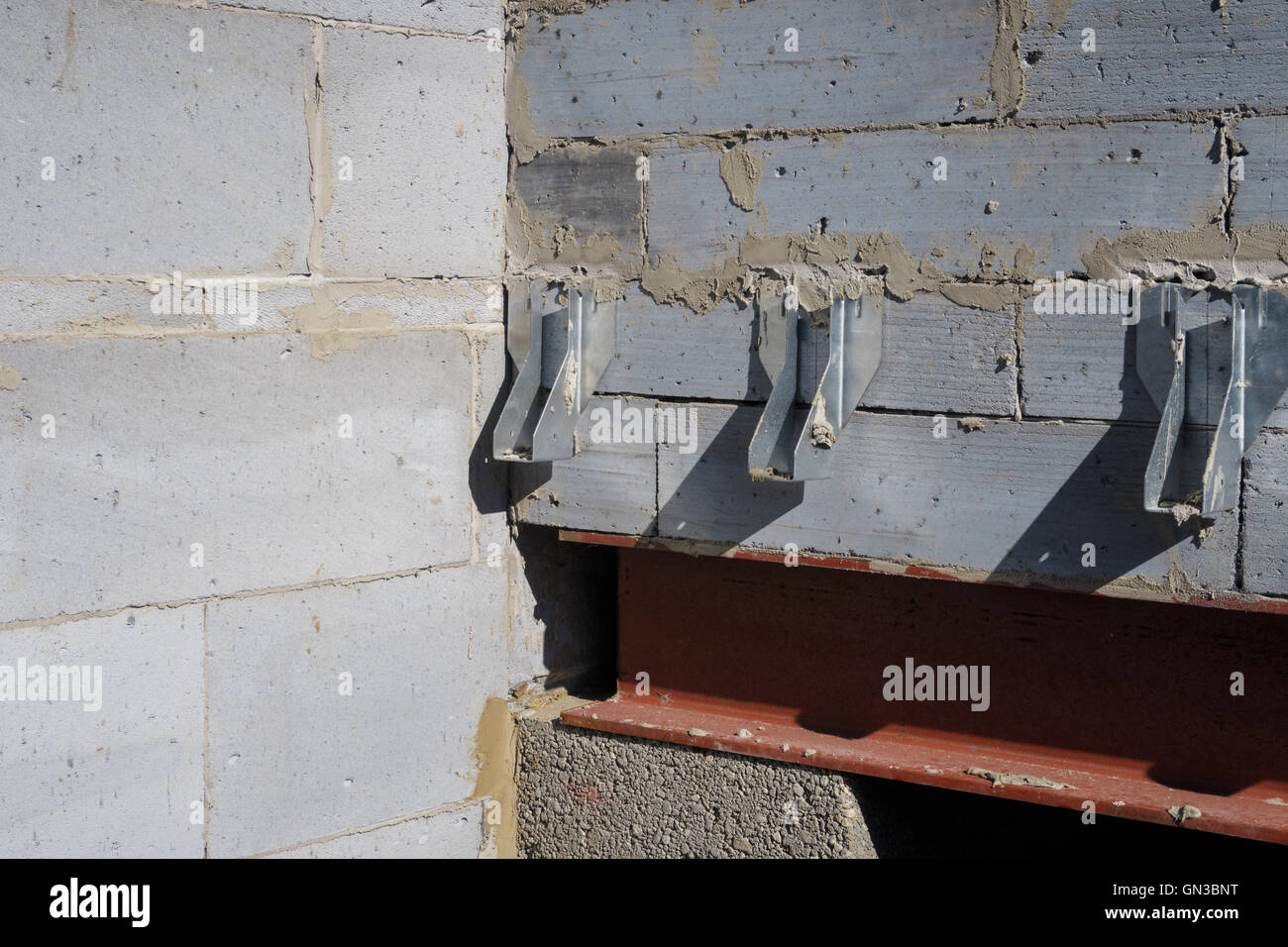 Galvanised joist hangers within interior of house build in progress