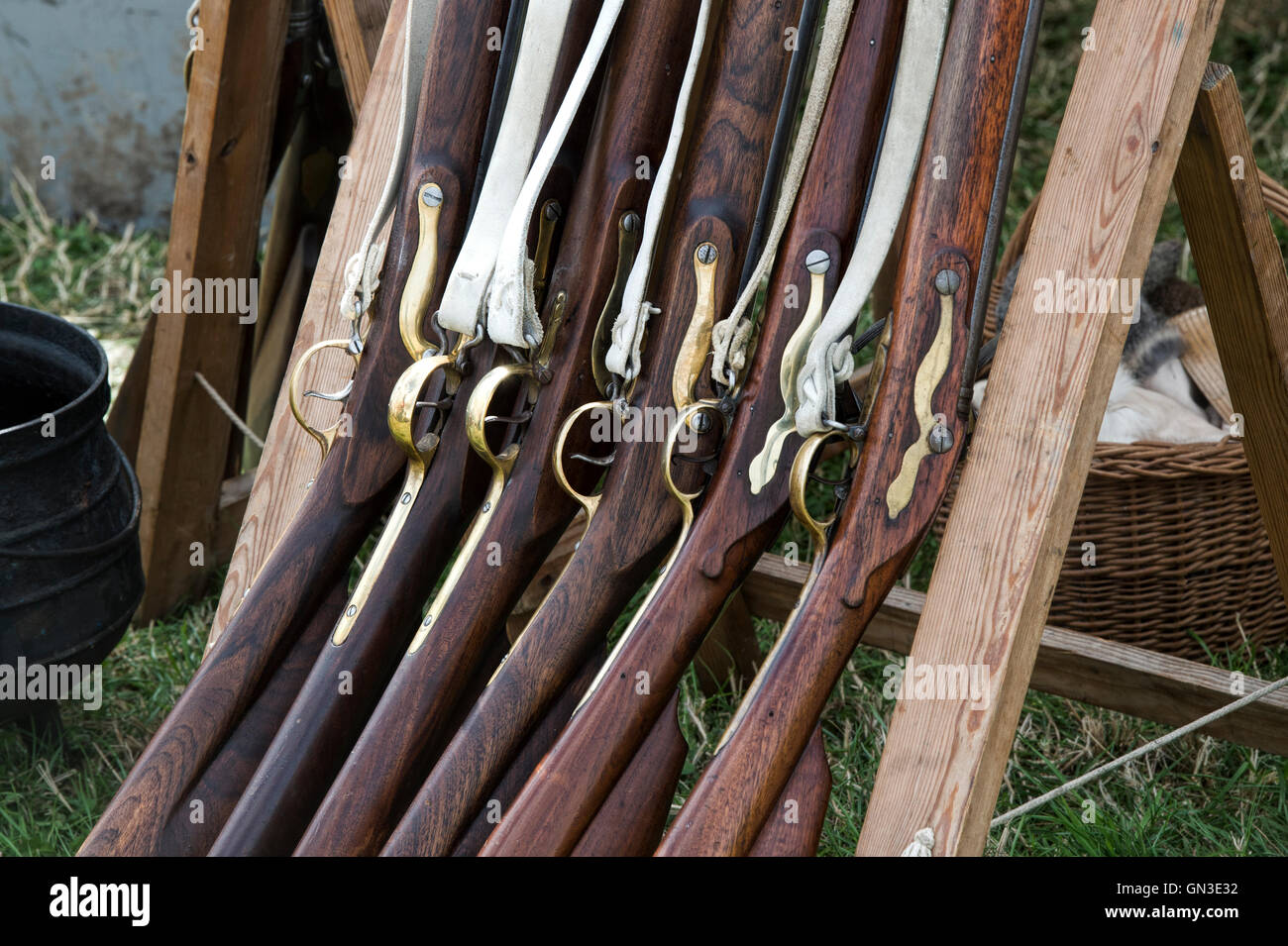 Muskets in Coldstream Regiment of Foot Guards camp at a reenactment. Spetchley Park, Worcestershire, England Stock Photo