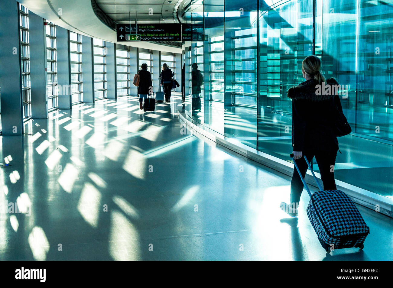 Dublin Airport Terminal One passengers with hand luggage arrivals, Ireland Stock Photo