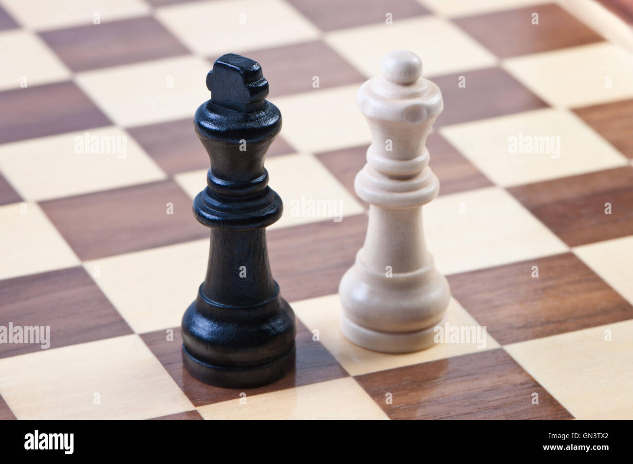 Figures on the chess board, kings and queen. Stock Photo