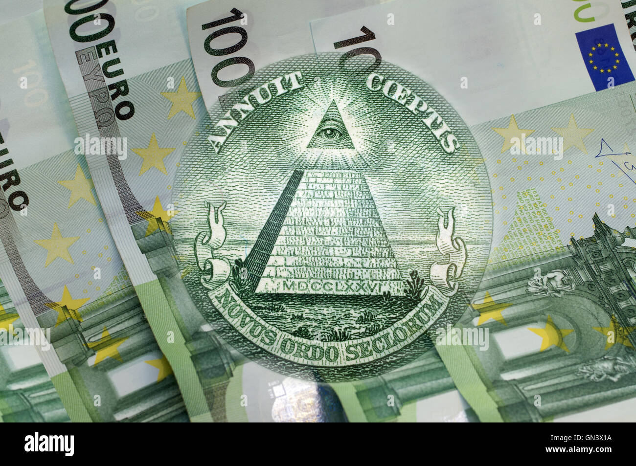 Element of the image of United States one-dollar bill, pyramid, Eye of Providence above one hundred euros banknotes. Conceptual Stock Photo