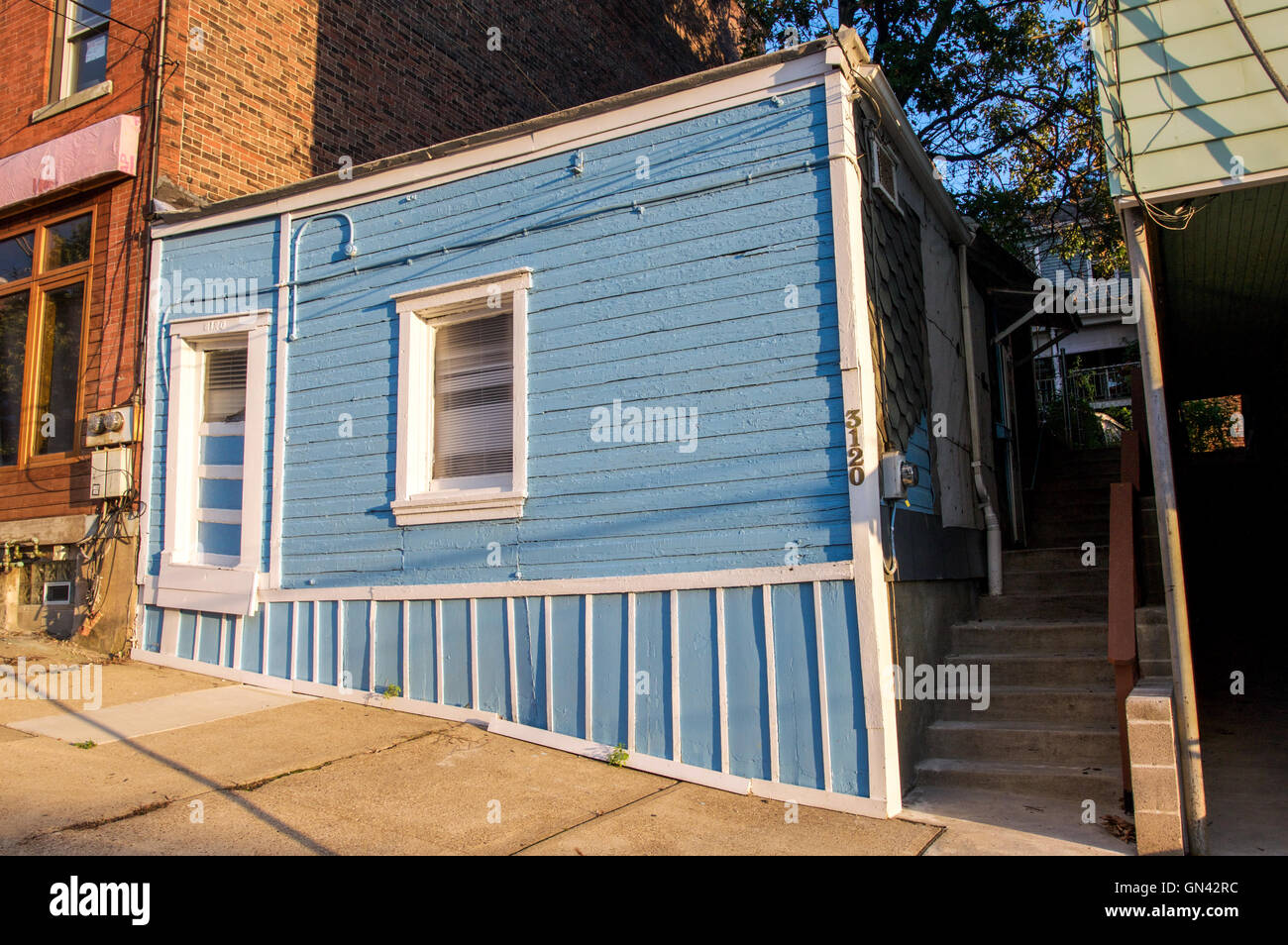 A quirky and colorful blue house in Pittsburgh's Polish Hill