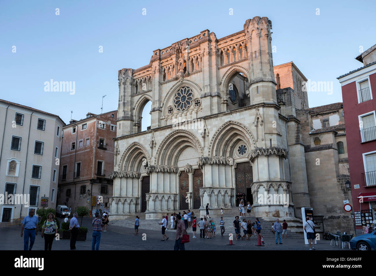 Tourists walk near the facade of the Cuenca's Cathedral, The cathedral