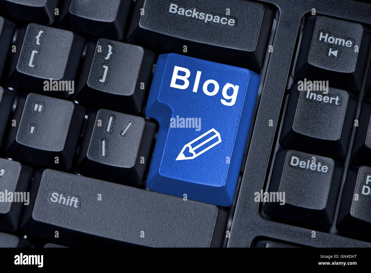 Computer keyboard button with word blog and icon pencil. Stock Photo