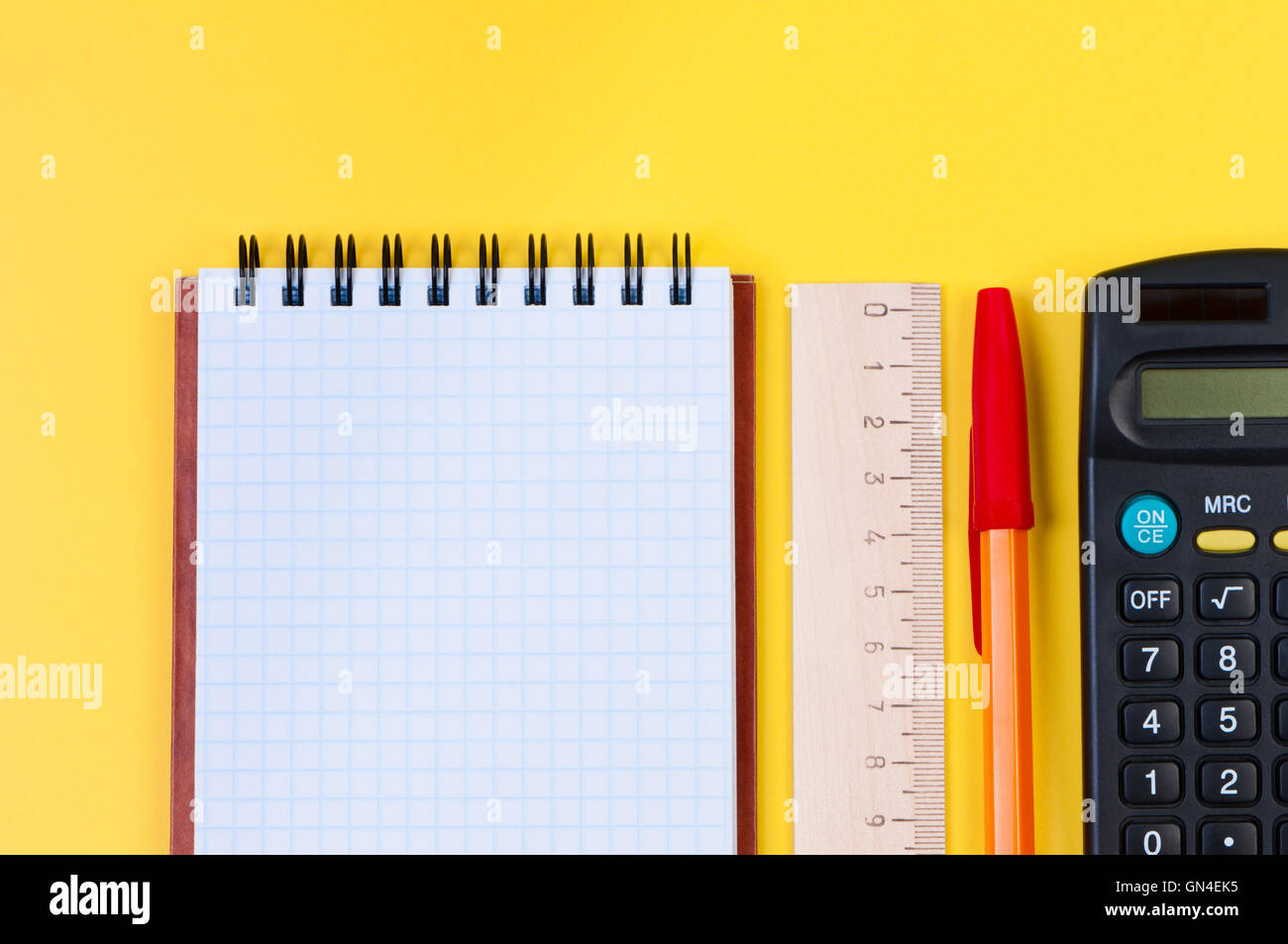 Office appliances on yellow background Stock Photo Alamy