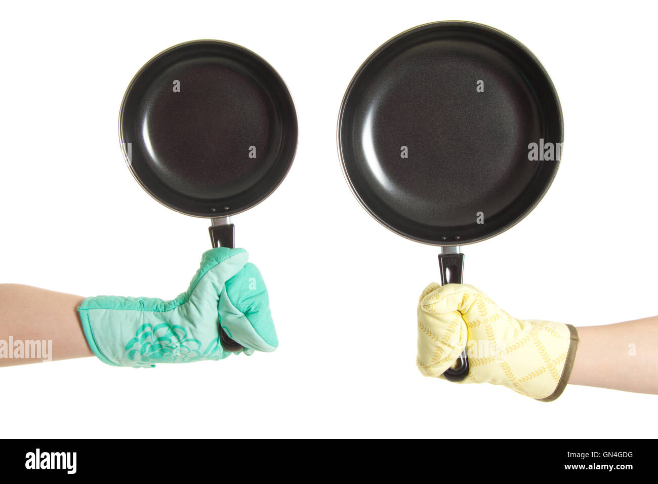 two hands in gloves holding pan's Stock Photo Alamy