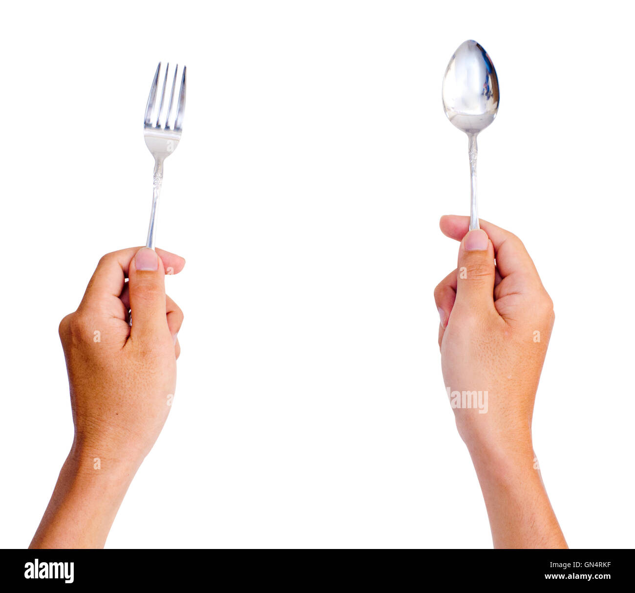 hands holding spoon and fork Stock Photo Alamy