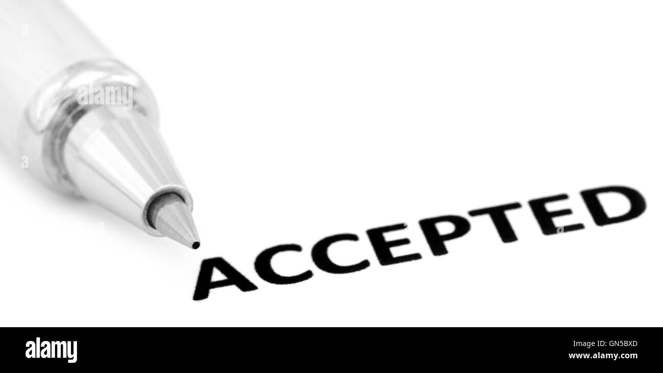 ACCEPTED written in a white paper with a silver ballpoint Stock Photo