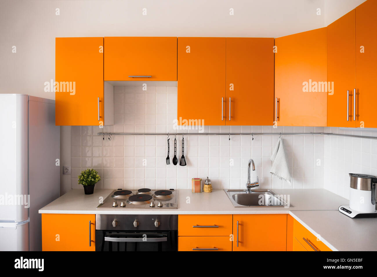 Orange kitchen set in modern style Stock Photo