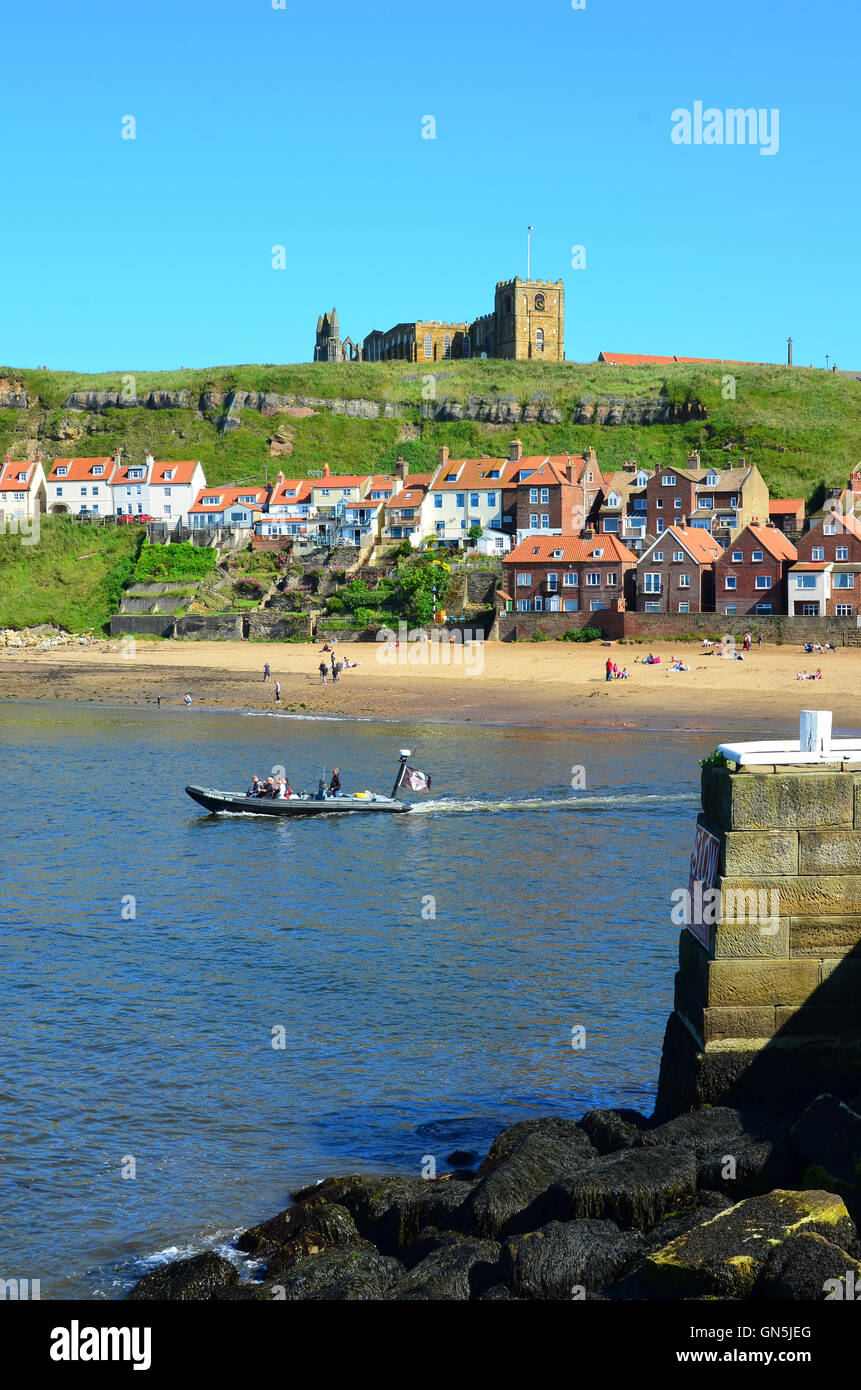 Boat entering Whitby harbour North Yorkshire England UK Stock Photo - Alamy