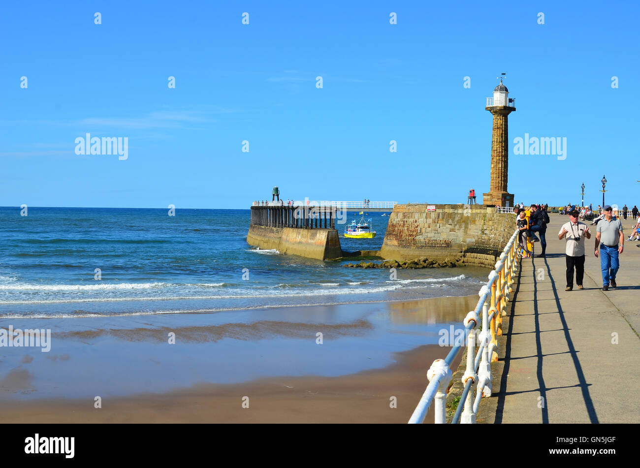 Boat entering Whitby harbour North Yorkshire England UK Stock Photo - Alamy
