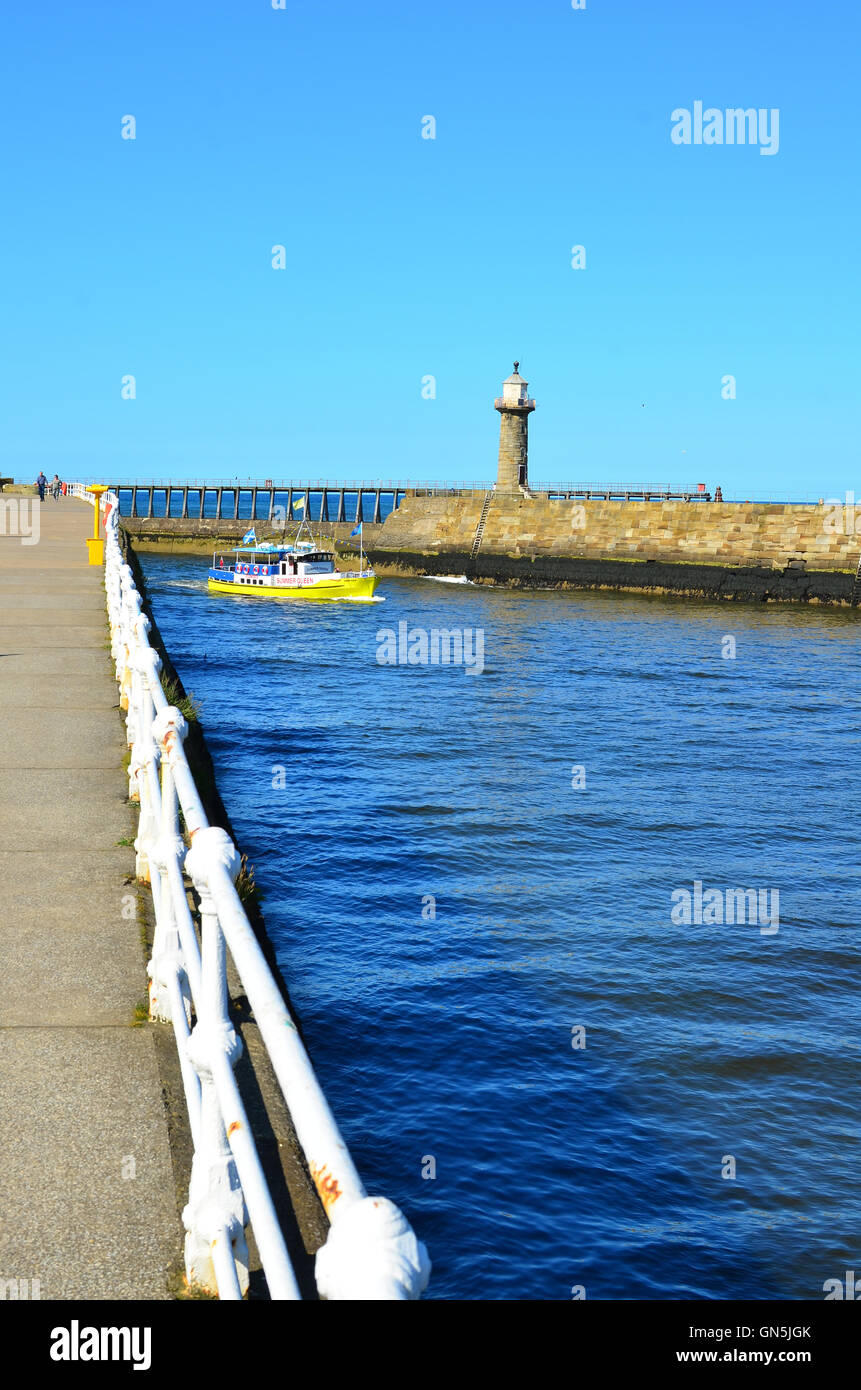 Boat entering Whitby harbour North Yorkshire England UK Stock Photo - Alamy