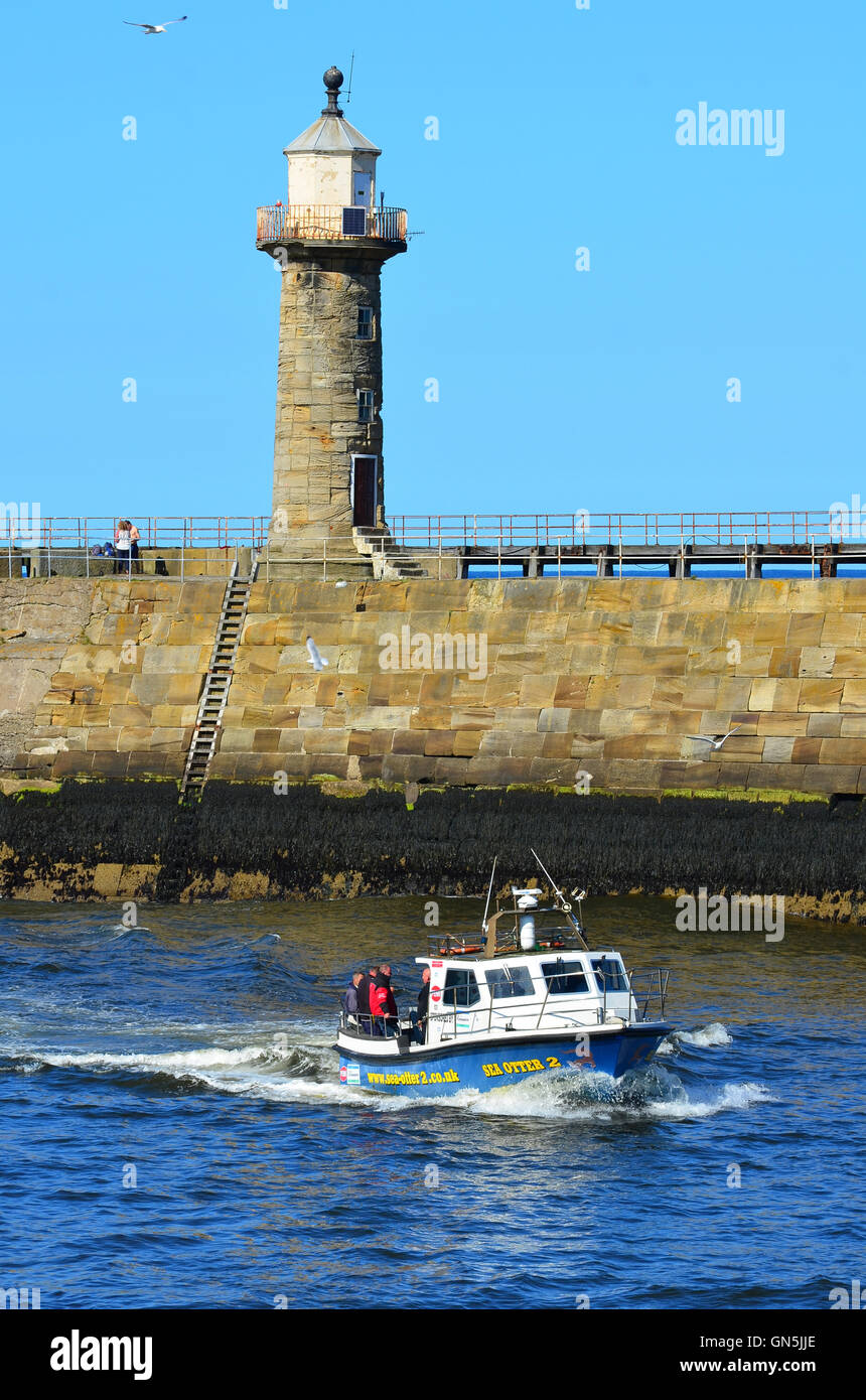 Boat entering Whitby harbour North Yorkshire England UK Stock Photo - Alamy
