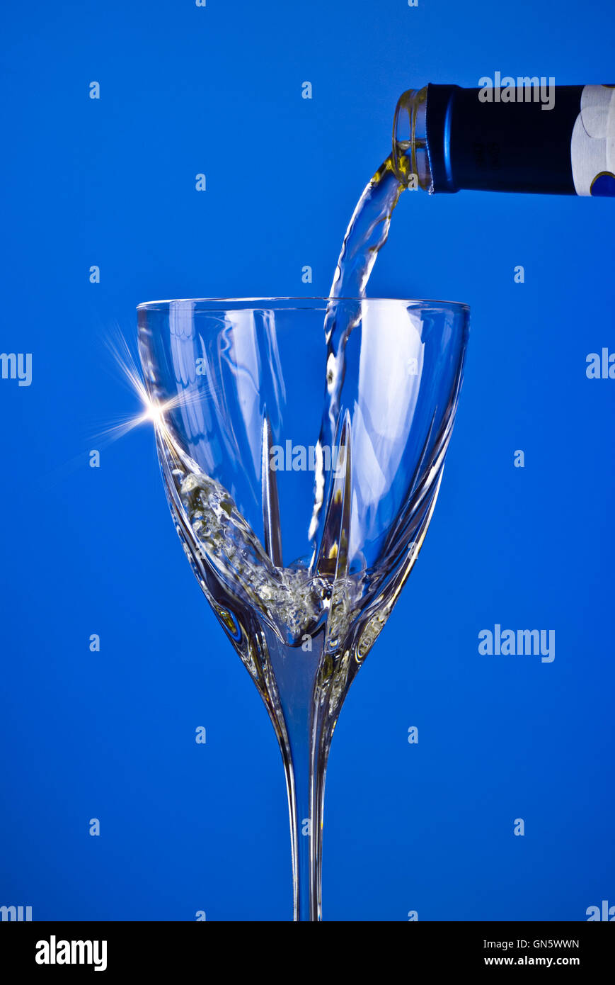 pouring wine into glass Stock Photo