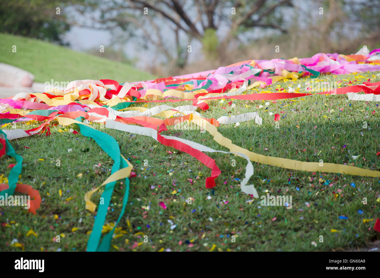 Chinese tradition and culture process colored paper put on a grave of ceremony in Qingming Festival at Sritasala Cemetery in Rat Stock Photo