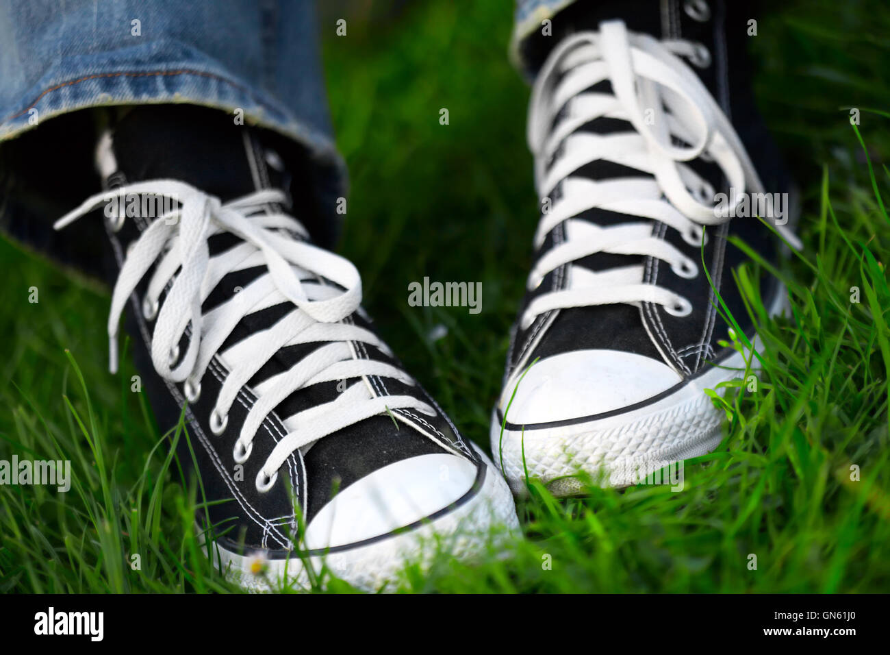 pair of sneakers in green grass Stock Photo