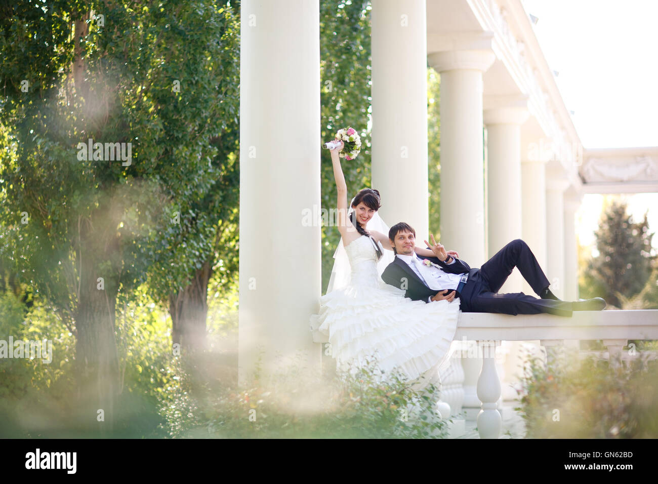 couple in columns Stock Photo - Alamy
