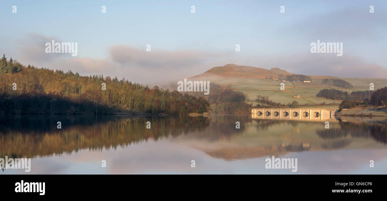 Ashopton Viaduct, trees and hills reflected in Ladybower Reservoir, Derbyshire, England, UK Stock Photo