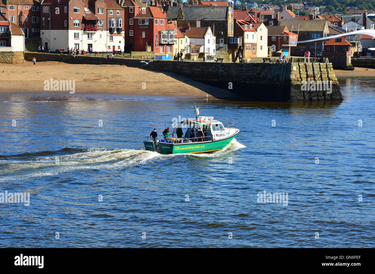 Boat entering Whitby harbour North Yorkshire England UK Stock Photo - Alamy